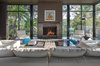Modern home with Living Room, Standard Layout Fireplace, Chair, Sofa, Wood Burning Fireplace, and Floor Lighting. Photographer: Taggart Sorenson Photo 5 of West Lake Hills Residence