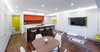 Modern home with Living Room, Recessed Lighting, Medium Hardwood Floor, Accent Lighting, Ceiling Lighting, Chair, Bar, Stools, Coffee Tables, and Media Cabinet. Overall View of Space Photo of DC Waterfront Residence