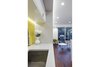 Modern home with Kitchen, Recessed Lighting, White Cabinet, Medium Hardwood Floor, Colorful Cabinet, Accent Lighting, Dishwasher, Undermount Sink, Ceramic Tile Backsplashe, and Engineered Quartz Counter. View of Kitchen Sink Alcove Photo 5 of DC Waterfront Residence