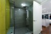 Modern home with Bath Room, Ceramic Tile Wall, Accent Lighting, Enclosed Shower, Recessed Lighting, Wall Mount Sink, Engineered Quartz Counter, One Piece Toilet, and Ceramic Tile Floor. View of Shower Photo 19 of DC Waterfront Residence