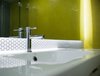 Modern home with Bath Room, Ceramic Tile Wall, Wall Mount Sink, Ceramic Tile Floor, One Piece Toilet, Engineered Quartz Counter, Enclosed Shower, Accent Lighting, and Recessed Lighting. Detail View of Bathroom Photo 20 of DC Waterfront Residence