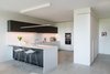 Modern home with Kitchen, Porcelain Tile Floor, and White Cabinet. Boffi Georgetown Waterfront Condo Project - Kitchen and Entry Closet Photo of Waterfront Condo Project