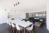 Modern home with Living Room, Chair, Accent Lighting, Dark Hardwood Floor, and Gas Burning Fireplace. Lining Room & Kitchen Photo 11 of Residence J&C