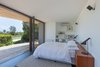 Modern home with Bedroom, Bed, and Dark Hardwood Floor. Bedroom & Ground Floor Deck Photo 12 of Residence J&C