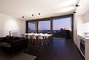 Modern home with Living Room, Dark Hardwood Floor, and Accent Lighting. Living Room at Dusk Photo 14 of Residence J&C