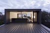 Modern home with Windows, Wood, and Picture Window Type. Living Room at Dusk Photo 15 of Residence J&C