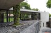 Modern home with Exterior, House Building Type, Concrete Siding Material, and Flat RoofLine. View from the entrance to the living room Photo 7 of Crater House