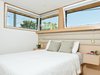 Modern home with Bedroom, Ceiling Lighting, Accent Lighting, Pendant Lighting, Night Stands, and Bed. master bedroom Photo 3 of 8th and Slocan Laneway House