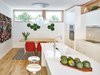Modern home with Kitchen, Engineered Quartz Counter, White Cabinet, Medium Hardwood Floor, Pendant Lighting, Ceramic Tile Backsplashe, Recessed Lighting, Wall Oven, Microwave, Undermount Sink, and Cooktops. Kitchen and dining Photo of 8th and Slocan Laneway House