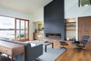 Contemporary living room with a lakeview. Photo 2 of The Lakehouse modern home