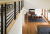 Looking down at the living room and dining room. Photo 3 of The Lakehouse modern home