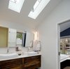 The master bath features Ikea Godmorgan cabinets with custom, reclaimed wood drawer fronts. Photo 2 of Illumination House modern home