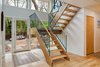 Galaxy removed a hallway above the entry way to open up the space. Photo 4 of Illumination House modern home
