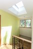 white(out) house: an operable Velux skylight at the top of the staircase creates a breeze throughout the house when windows are open. Photo 7 of white(out) house modern home
