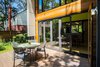 Modern home with Outdoor. white(out) house: La Cantina bifold door creates seamless indoor/outdoor living. Photo 11 of white(out) house