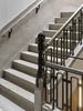 Modern home with Staircase. A close-up detail showcases intricate ironwork on the building’s main staircase. Photo 7 of W Amsterdam
