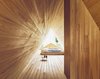 Modern home with Bedroom. Th bedroom space is backlit by a unique A shape that provide ample natural light—reflecting the cedar's warm tones. Photo 10 of Yoshino Cedar House