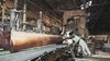 Long beams are prepared by workers in a factory, ready to be used to build Yoshino Cedar House. Photo 4 of Yoshino Cedar House modern home
