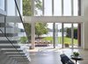 Modern home with Living Room, Sofa, Light Hardwood Floor, End Tables, Table, and Chair. view from new living room towards river Photo 3 of The River House