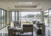 Modern home with Living Room, Coffee Tables, End Tables, Sofa, Chair, Recessed Lighting, and Concrete Floor. Sunroom Photo 10 of Long Island Sound House