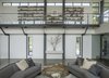 Modern home with Living Room, Sofa, Console Tables, Chair, Coffee Tables, Recessed Lighting, Wood Burning Fireplace, and Concrete Floor. Living room Photo 14 of Long Island Sound House