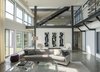 Modern home with Living Room, Bookcase, Coffee Tables, Bench, Ottomans, Recessed Lighting, Sofa, Chair, Floor Lighting, Concrete Floor, and Wood Burning Fireplace. Living room Photo 15 of Long Island Sound House