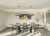Modern home with Dining Room, Chair, Accent Lighting, Table, Ceiling Lighting, Concrete Floor, and Storage. Dining room Photo 2 of Long Island Sound House