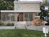 Modern home with Exterior, House Building Type, Wood Siding Material, Stucco Siding Material, Concrete Siding Material, Metal Roof Material, Flat RoofLine, and Stone Siding Material. Street view and entry approach Photo 2 of Old Greenwich House