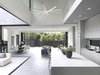 Modern home with Living Room, Ceiling Lighting, Accent Lighting, Gas Burning Fireplace, and Concrete Floor. Custom pocket doors open throughout the entire ground floor to create a one of a kind indoor/outdoor space throughout. Photo 3 of Wylan/James Residence