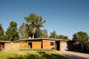 We added more glass to the front facade, however it is still sensitive to the original slot & trapizoidal clerestory windows. Krisana Park, Denver, CO Cadence Design Studio Photo 6 of Krisana Park Renovation modern home