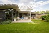 Modern home with Outdoor, Back Yard, Vegetables, Raised Planters, Large Patio, Porch, Deck, Wood Patio, Porch, Deck, Concrete Patio, Porch, Deck, Planters Patio, Porch, Deck, Hardscapes, Horizontal Fences, Wall, and Wood Fences, Wall. The large patio is broken up with Fijian mahogany flush deck off the master suite. Krisana Park, Denver, CO Cadence Design Studio Photo 8 of Krisana Park Renovation