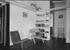 Modern home with Living Room, Chair, and Bookcase. Interior of one of Lake Jackson, Texas U.S. Defense Houses designed by Alden B. Dow. Photo 3 of The City of Lake Jackson Texas