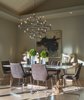 Seductive lighting creates ambiance around a Formworks marble-topped dining table. McGuire dining chairs are comfortable enough to spend an entire evening. Photo 3 of A New Beginning modern home