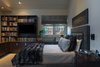 Multi-functional bedroom serves as office, den and music room in addition to sleeping quarters. Photo 7 of A New Beginning modern home