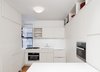 The Refrigerator, dishwasher and clothes washer are concealed behind cabinet doors and cabinets extended to the ceiling to maximize usable storage space. Photo 3 of Prewar Modern Upgrade modern home