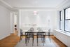 A classic pendant light, floating buffet cabinet and light washed art wall create an intimate but modern setting for dining. Photo 5 of Prewar Modern Upgrade modern home