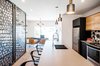 Good view of the kitchen, staircase with custom made walls and dining room Photo 9 of Concept DUB House modern home