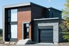 Modern home with Exterior, House Building Type, Wood Siding Material, Metal Siding Material, and Stone Siding Material. Modern façade with a mix of red cedar and lap siding by GOODFELLOW. Custom windows are by FENETRES 2000 and natural stone by PANGAEA. Photo 7 of James house