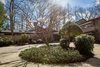 At the end of a long drive, the spacious "car court" is softened by native plantings. Photo 2 of Mid-century Modern Gathering Space modern home