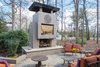 Schechter placed the monumental fireplace to block views of the neighbor's house, thus providing her clients and their guests with a greater sense of privacy. Photo 11 of Mid-century Modern Gathering Space modern home