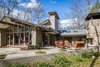 As seen from the backyard, the new outdoor gathering space is tucked comfortably within the form of the original mid-century modern house. Photo 12 of Mid-century Modern Gathering Space modern home