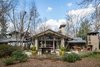 In context with the entire rear elevation, the new outdoor fireplace is an approprate presence. Photo 13 of Mid-century Modern Gathering Space modern home