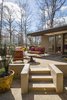 The new stairs Schechter fashioned to lead up to the outdoor gathering space. Photo 7 of Mid-century Modern Gathering Space modern home