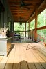 Modern home with Exterior, Metal Roof Material, Concrete Siding Material, Farmhouse Building Type, and Gable RoofLine. Wire fencing is a simple, honest solution for the porch railings. Photo 5 of Modern, Passive, Net Zero Farmhouse