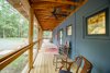 Modern home with Exterior, Metal Roof Material, Concrete Siding Material, Gable RoofLine, and Farmhouse Building Type. Screening on the side porch, facing the driveway, keeps insects at bay during the Southern summer. Photo 6 of Modern, Passive, Net Zero Farmhouse