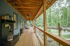 Modern home with Exterior, Gable RoofLine, Farmhouse Building Type, Metal Roof Material, and Concrete Siding Material. Like old farmhouses, the porch is meant for relaxing and enjoying nature. It also helps shade the interior from the high summer sun. Photo 4 of Modern, Passive, Net Zero Farmhouse