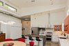 Modern home with Pendant Lighting, Concrete Floor, and Recessed Lighting. The high ceiling accommodates a row of clerestory windows at the front of the house. Photo 17 of The Serdar Net Zero-Net Positive Micropolis® House