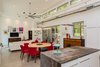 Modern home with Recessed Lighting and Concrete Floor. A factory fan from Big Ass Fans® keeps the indoor air moving. Photo 14 of The Serdar Net Zero-Net Positive Micropolis® House