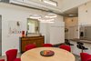 Modern home with Pendant Lighting, Concrete Floor, and Recessed Lighting. In the central dining area and throughout the house, exposed ductwork helps satisfy the homeowners' desire for an "almost industrial" ambiance. Photo 15 of The Serdar Net Zero-Net Positive Micropolis® House