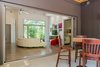 Modern home with Outdoor, Back Yard, and Concrete Patio, Porch, Deck. A folding glass door system opens the house to the back porch and extends the living space. Photo 7 of The Serdar Net Zero-Net Positive Micropolis® House